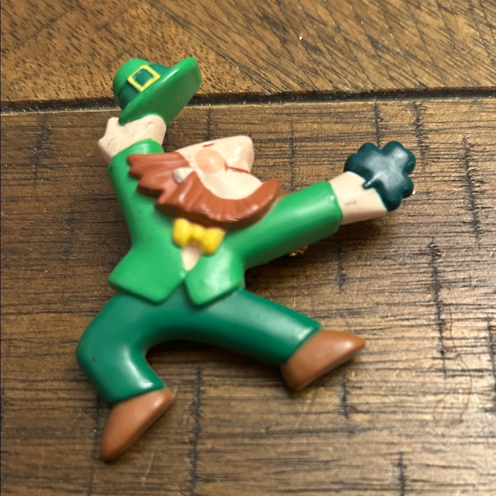 vintage Hallmark St. Patrick's Day dancing leprechaun pin or brooch.